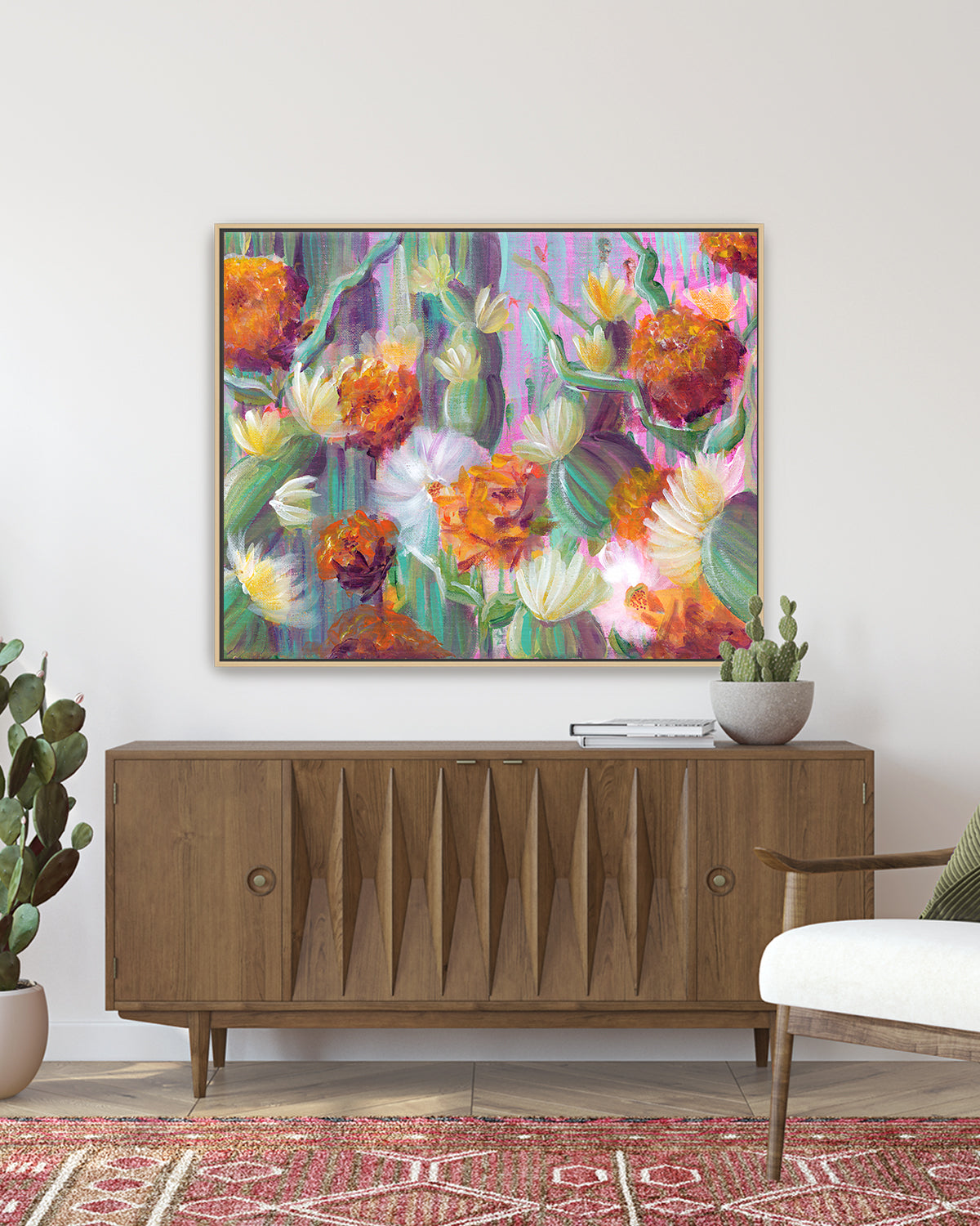 Flowering Cacti No. 003 framed canvas art print featuring flowering cacti. Mockup above a living room console table.