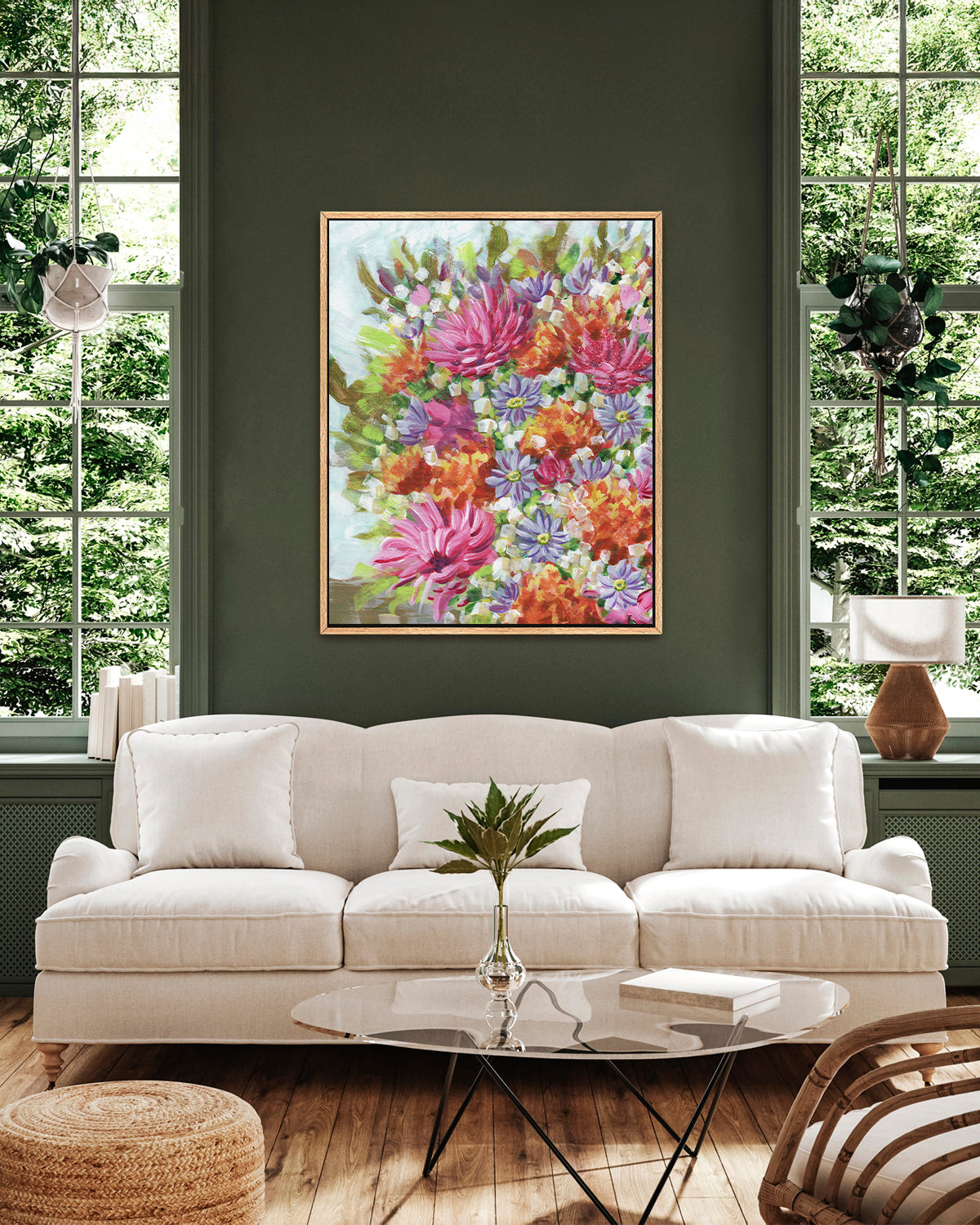 Bouquet No. 005 framed canvas art print featuring vibrant pink, orange, and purple flowers. Mocked up above a sofa.