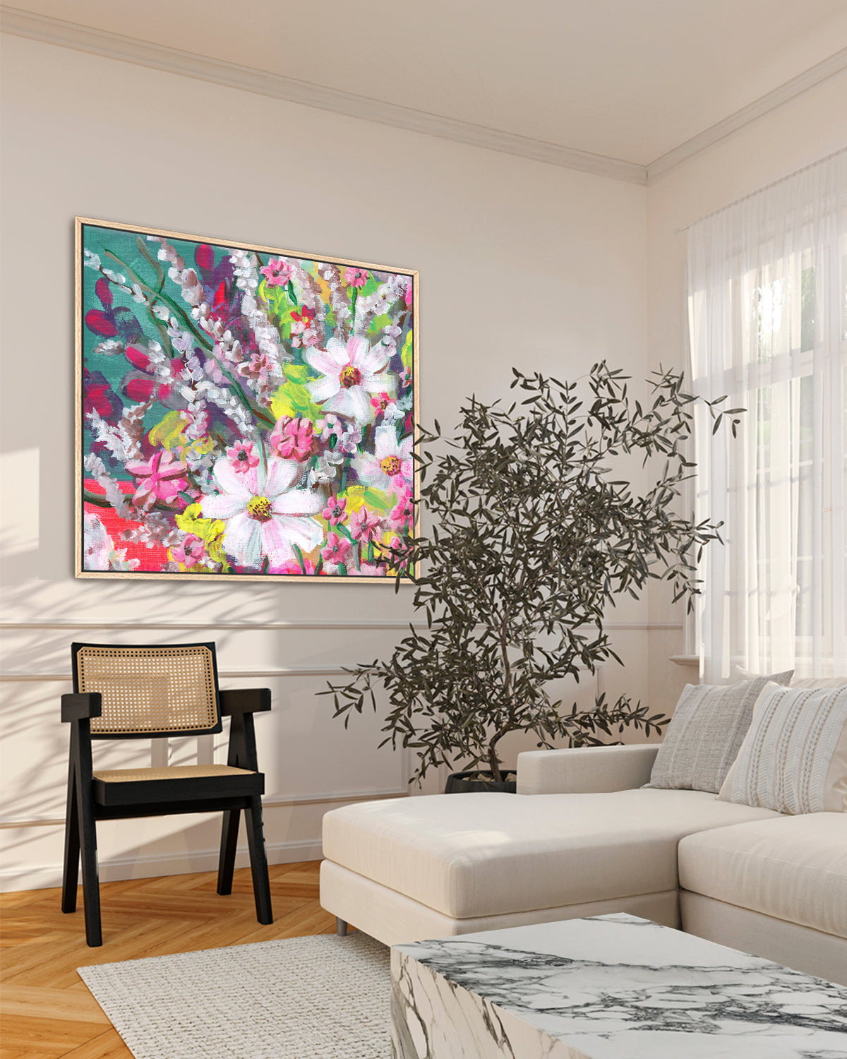 Loose Florals No. 001 framed canvas art print featuring an assortment of vibrant flowers in white, pink, teal and lime green. Mockup above chair and sofa in a living room.