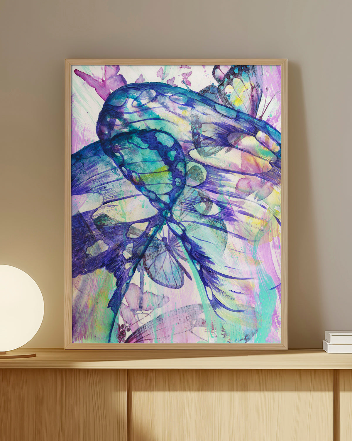Surged Veil framed art print featuring butterfly wings from the point of view of being inside of a cocoon. Mockup on a shelf.