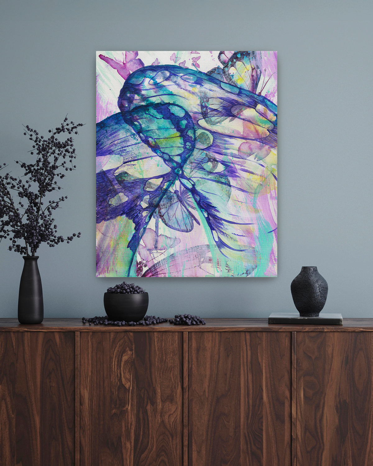 Surged Veil stretched canvas art print featuring butterfly wings from the point of view of being inside of a cocoon. Mockup above a console table.