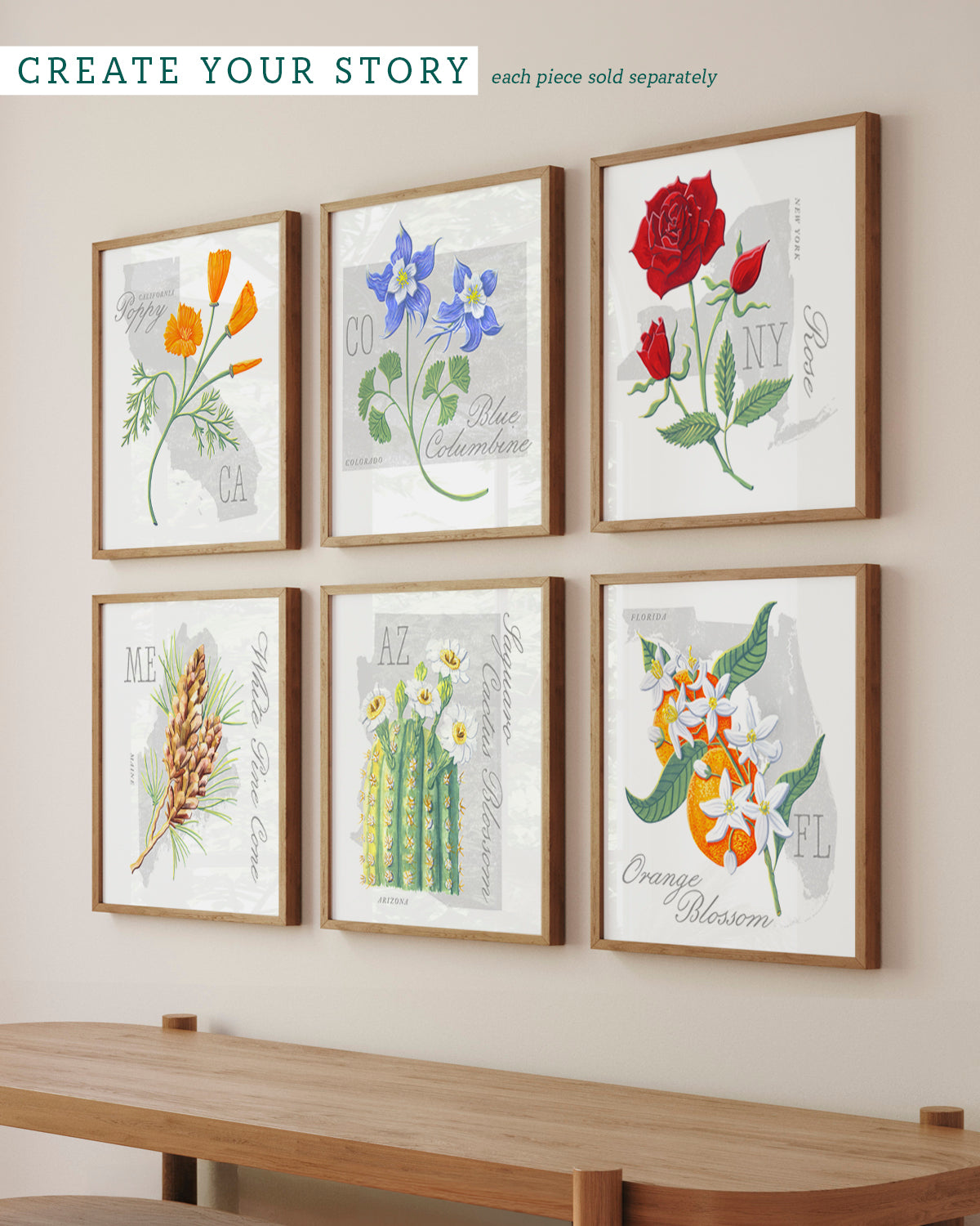 Six framed state flower botanical art prints by Jen Montgomery arranged in two rows on a beige wall above a wooden console table. The prints feature different flowers and plants including a red rose, orange blossoms, blue columbine, cactus, and white flowers, each in a light wood frame.