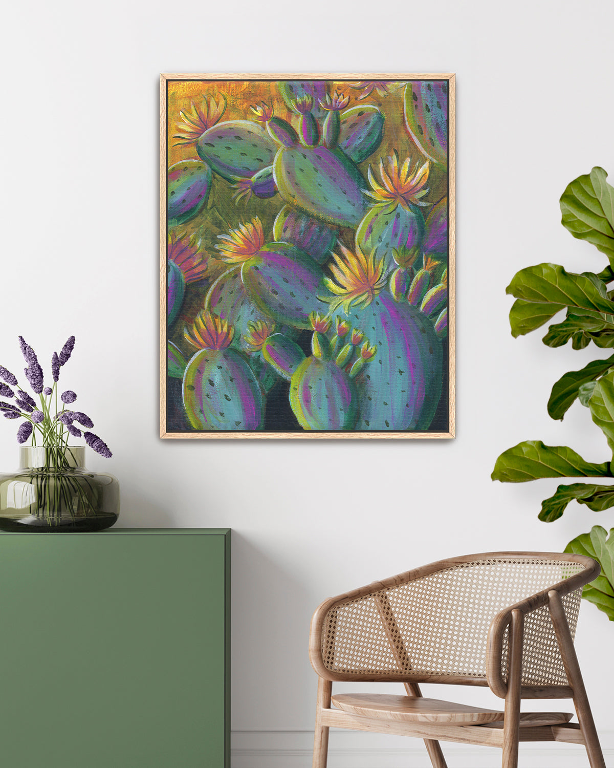 Flowering Cacti No. 001 framed canvas art print featuring flowering cacti. Mockup above a table and console.