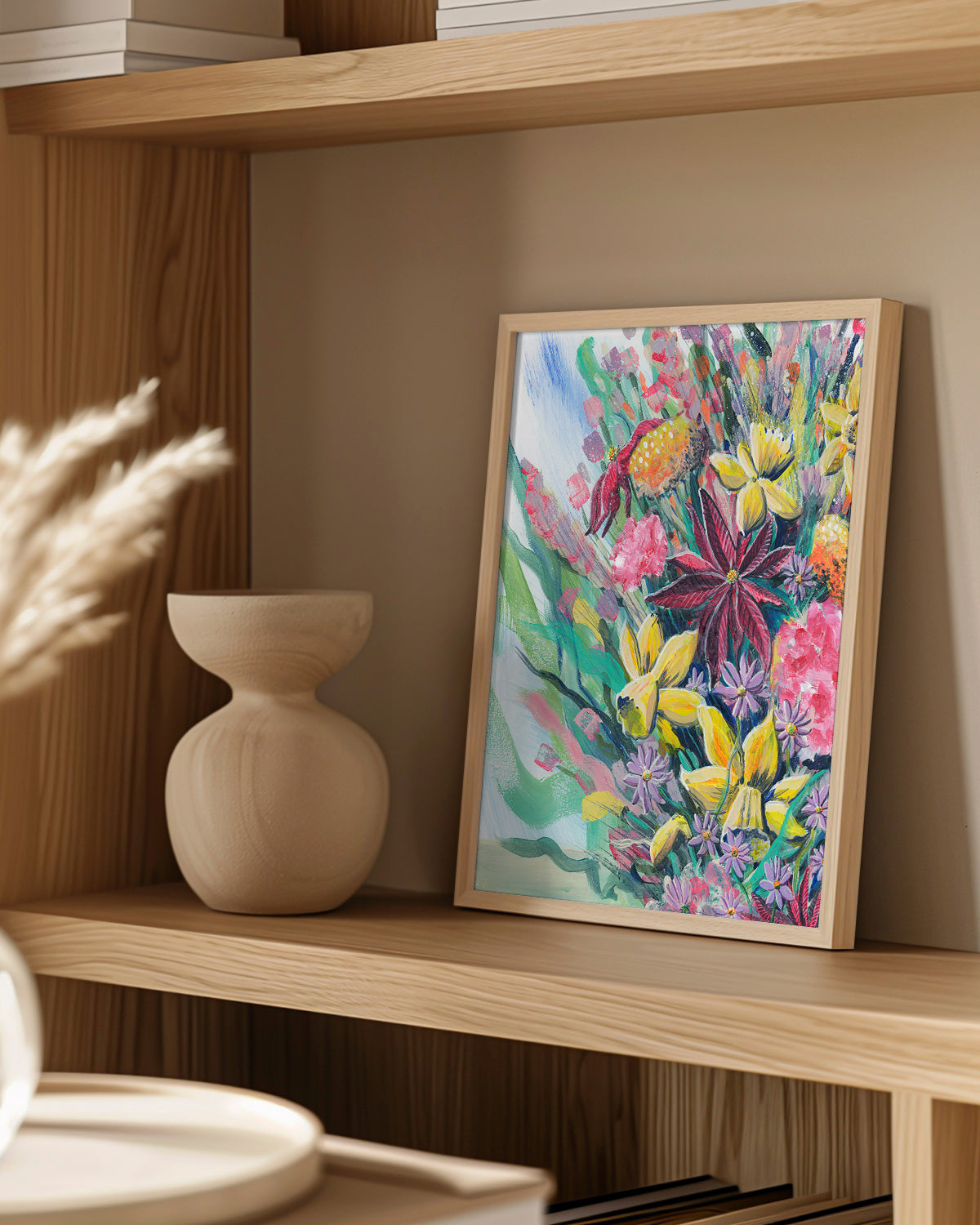 Bouquet No. 003 framed art print featuring an assortment of birth vibrant birth month flowers including Carnations (January), Daffodils (March), Asters (September), Marigolds (October), and Poinsettias (December). Mockup on a wood shelf.