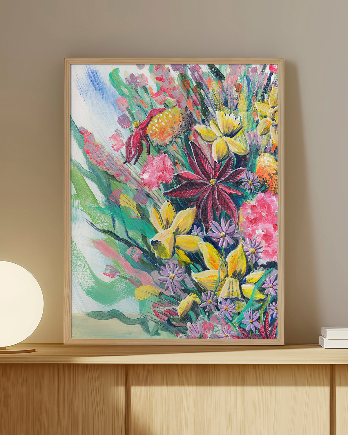 Bouquet No. 003 framed art print featuring an assortment of birth vibrant birth month flowers including Carnations (January), Daffodils (March), Asters (September), Marigolds (October), and Poinsettias (December). Mockup on a wood shelf.